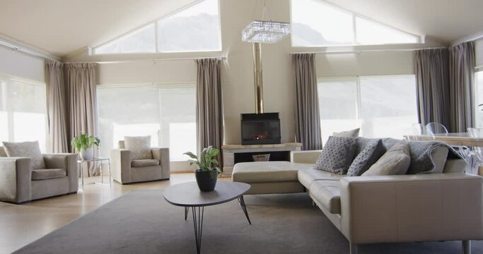 General view of modern living room with fireplace and furniture with copy space, slow motion