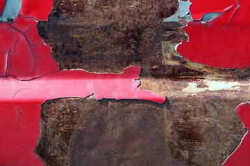 An old cracked red painted on metal surface, Abstract grunge background for design.