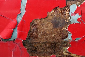 Old cracked red painted on metal surface, Abstract grunge background for design.