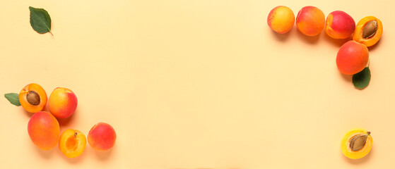 Sweet apricots on beige background with space for text, top view