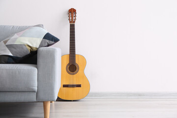 Sofa and guitar in modern room