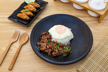 Thai Basil Minced beef,Stir fired ground beef with garlic and basil leaf in chilli sauce with Cooked rice topped with fried egg (Pad Kra pao).