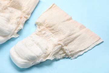 Period panties on blue background, closeup