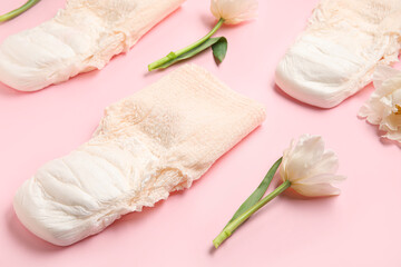 Period panties with tulips on pink background, closeup