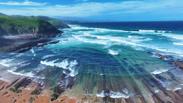 Colors and rock formations of El Sable beach. Coastal landscape in the town of Tagle. Aerial view from a drone. Suances Municipality. Cantabrian Sea. Cantabria. Spain. Europe