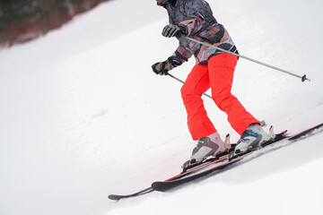 Naklejka premium Alpine skier close-up on the ski slope.