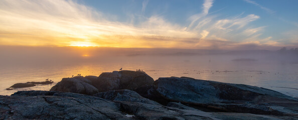 Rocky Shore on the Pacific Ocean Coast. Foggy Sunset. Victoria, Vancouver Island, BC, Canada.