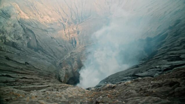 Video of the steaming active volcano crater of the Bromo on the Java island