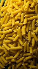 Yellow penne pasta on green texture, generative ai