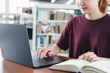 girl student study online with teacher, happy young woman with internet learning in library,...