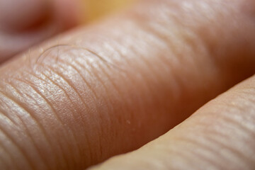  High-resolution image of human finger skin under macro closeup.