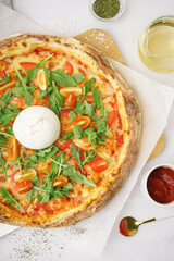 Tasty pizza with Burrata cheese on white background