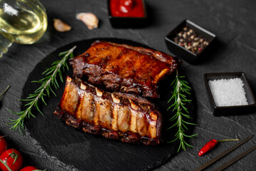 grilled pork ribs on stone background