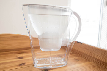 Water filter on the wooden table