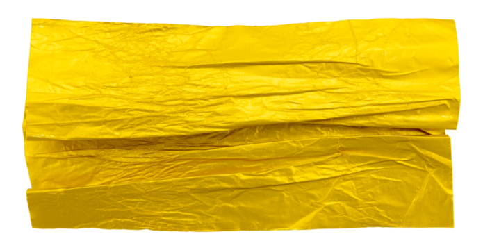 A piece of crumpled yellow foil on a white background. Foil