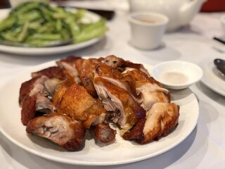 Crispy roasted chicken plate with a side of salt