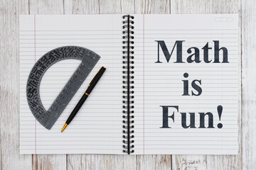 Math is fun message with ruled line notepad with pen and protractor