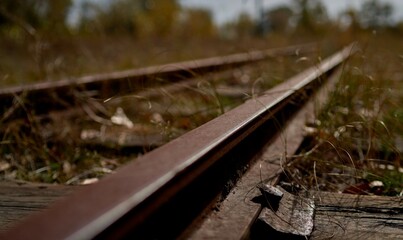 the old railway is overgrown with grass