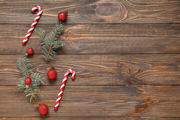 Composition with fir branches and Christmas decorations on wooden background