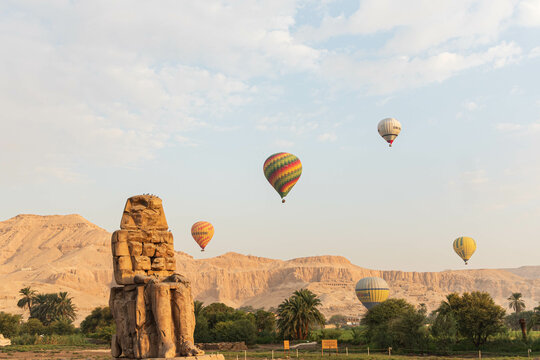 Colossi of Memnon in Egypt: Majestic ancient statues guarding the historical wonders of Luxor, echoing the Pharaoh's enduring legacy.