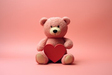 Valentines Day big Teddy bear holding a red heart in pink background 