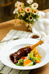 Lamb Ossobuco or Osso buco lamb shanks with potato, dip and salad served on plate isolated on napkin side view of meat food