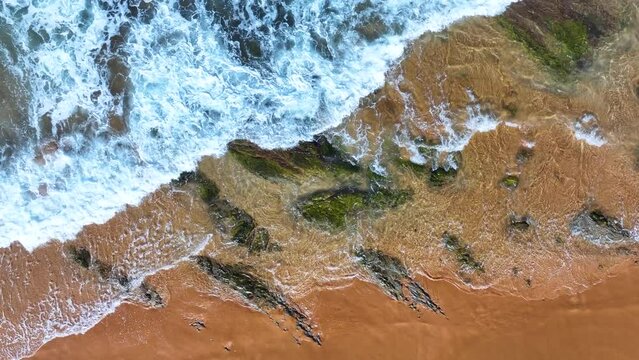 Colors and rock formations of El Sable beach. Coastal landscape in the town of Tagle. Aerial view from a drone. Suances Municipality. Cantabrian Sea. Cantabria. Spain. Europe