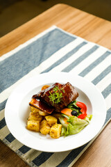 Beef Short Ribs served in plate isolated on napkin side view of korean style meat food