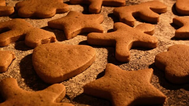 Baked christmas cookies. Process of baking traditional Christmas gingerbread cookies. Timelapse of gingerbread baked. Tasty brown cookies. Homemade bakery concept. Close-up in 4K, UHD