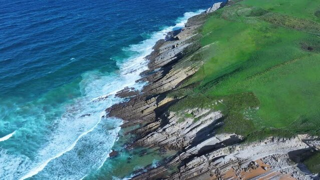 Colors and rock formations of El Sable beach. Coastal landscape in the town of Tagle. Aerial view from a drone. Suances Municipality. Cantabrian Sea. Cantabria. Spain. Europe