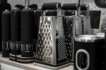Dishes in the kitchen. Vegetable grater with pepper shaker. Kitchenware.
