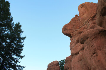 adventurous midwestern red sandstone rock formations against clear bright blue colorado sky