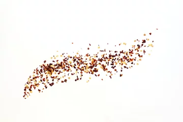 Poster hot red chili pepper flakes burst in white background as food background,top view with copy space © gv image