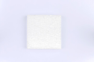 A square piece of white styrofoam