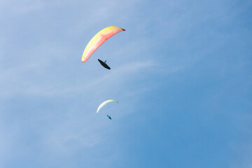 Paraglider Soaring in a Blue Sky