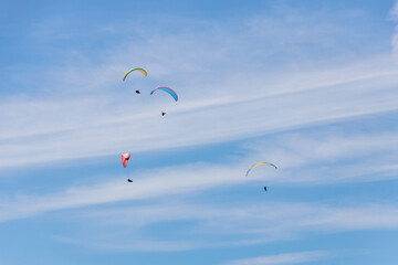 Paraglider Soaring in a Blue Sky