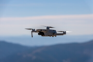 Fototapeta na wymiar Drone Flying in the Mountains