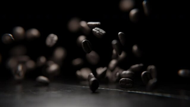 Close up of Coffee beans falling on a table