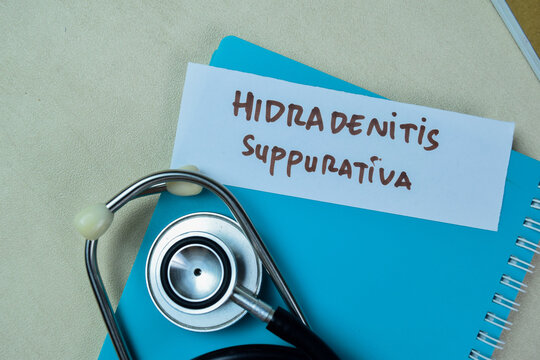 Concept of Hidradenitis Suppurativa write on sticky notes with stethoscope isolated on Wooden Table.