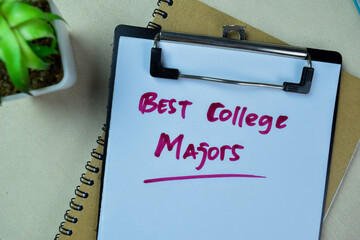 Concept of Best College Majors write on paperwork isolated on Wooden Table. - obrazy, fototapety, plakaty