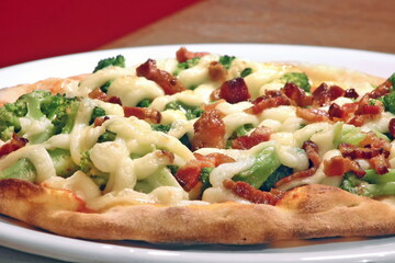 delicious bacon pizza with cheese and broccoli