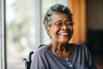 Portrait of a smiling disabled senior woman in a nursing home