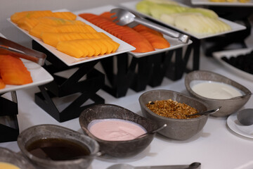dishes and trays with various fruits 