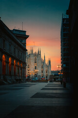 Milan Cathedral Square Milan Cathedral (Duomo di Milano) at sunrise from Merchants Square, no people, vertical view