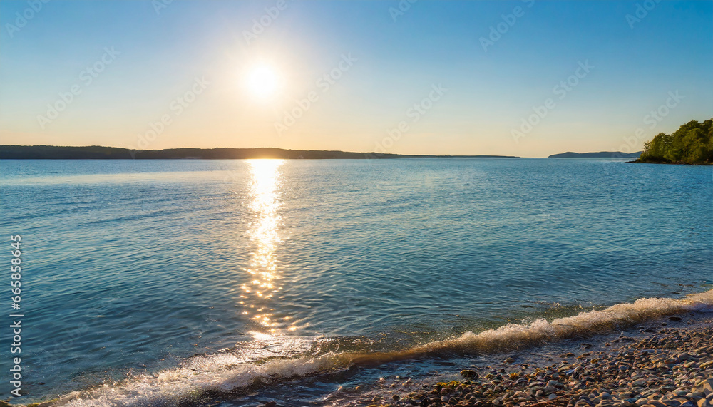 Wall mural summer seashore with calm water and golden sun reflection