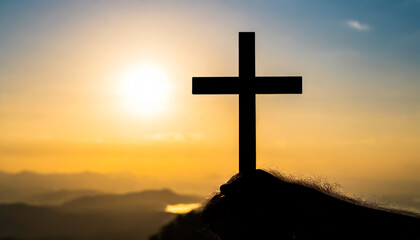 easter and good friday concept soft focus of christian worship with raised hand on cross sunset background