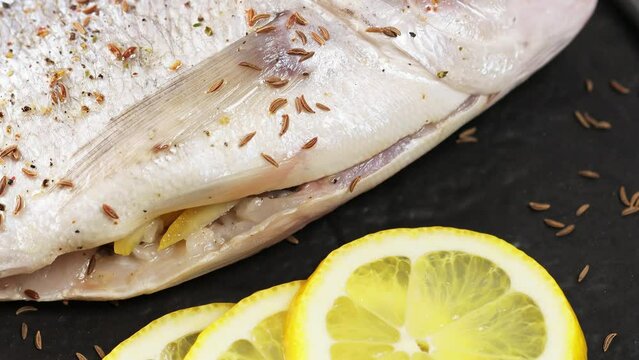 Cooking Fresh Dorado: Mediterranean Seafood Delight. Tilt Up Camera Movement
