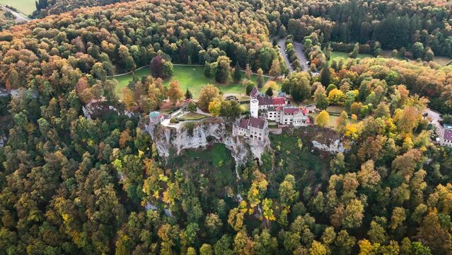 Aerial drone view medieval Lichtenstein castle on mountain, autumn Baden-Wurttemberg, Germany. High quality 4k footage