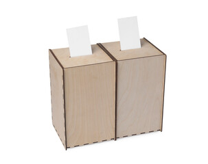Wooden ballot boxes with votes isolated on white