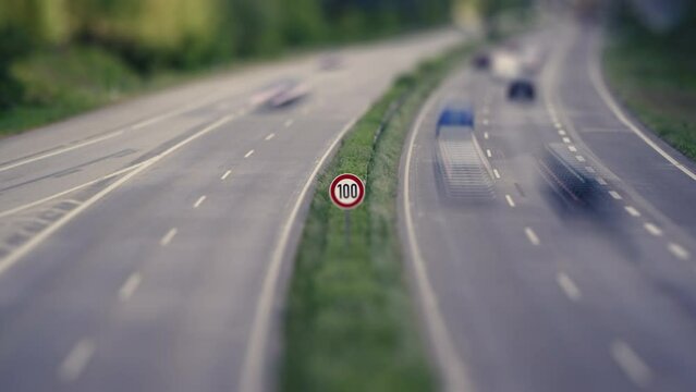 Highway and passing Cars in a miniature time lapse